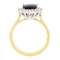18ct gold sapphire and diamond cluster ring, single oval cut sapphire of approx 2.60 carat, surrounded by sixteen round brilliant cut diamonds, hallmarked, total diamond weight approx 0.45 carat