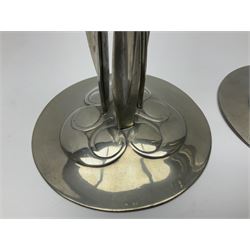 Archibald Knox (1864-1933) for Liberty & Co, pair of Tudric pewter candlesticks, the bud shaped sockets raised upon three angular fin supports and a slightly domed circular base with cast stylised foliate decoration, each stamped beneath Tudric 0223, H30cm