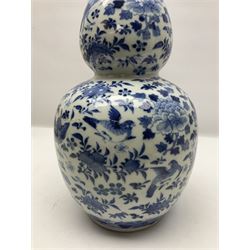 19th century Chinese blue and white double gourd form vase, decorated with blooming peonies and birds in flight, H36cm