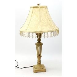 An antique style composite cream table lamp, with cream beaded shade, overall H67.5cm. 