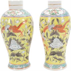 Pair of Chinese vases, of baluster form decorated with dragons amongst flowering peonies upon yellow ground, between bands of foliage, H24cm 