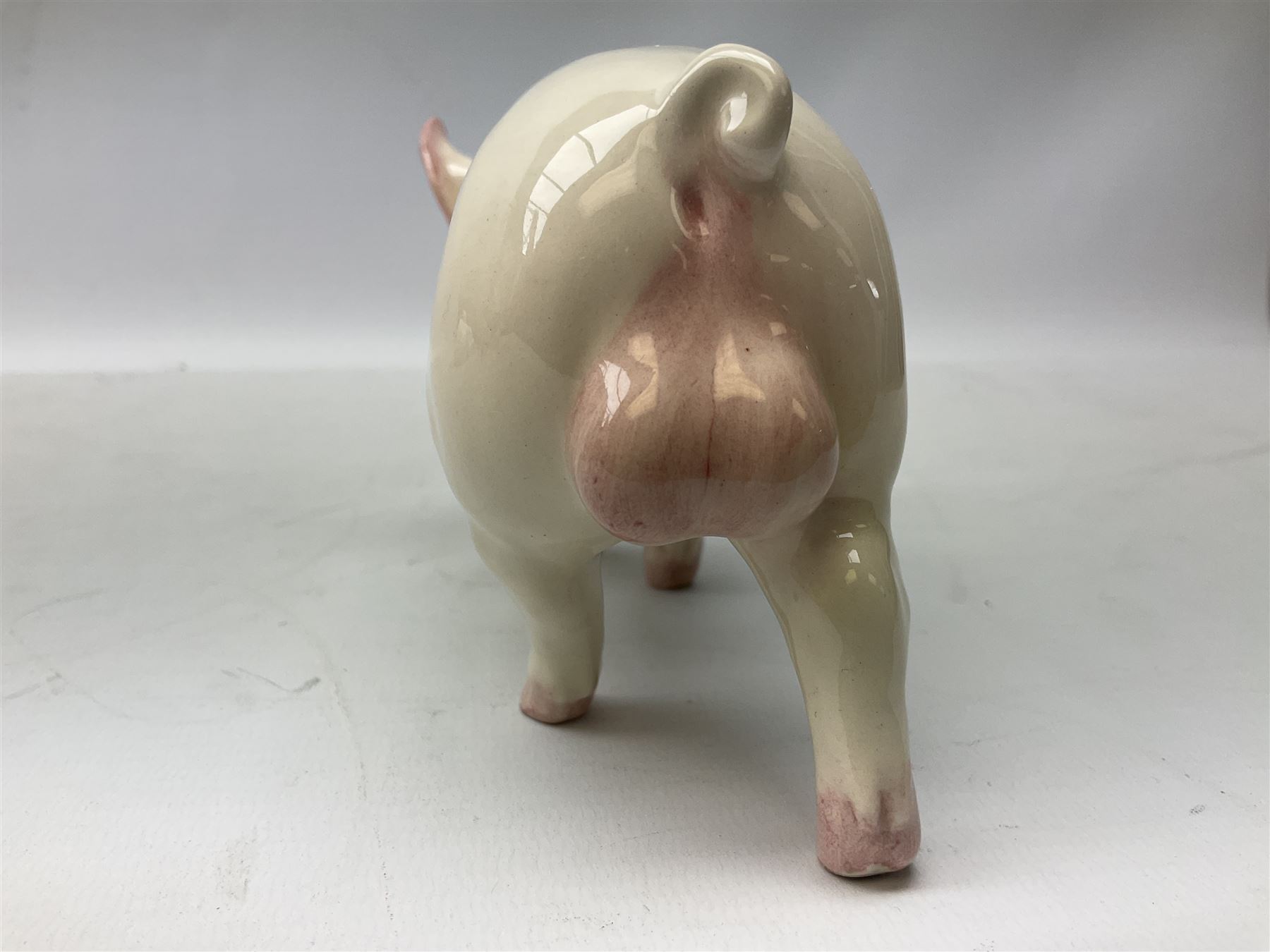 Collection of Beswick pig figures, to include John Beswick Little Likeables ‘Hide and Sleep’, white boar pig and John Beswick trio of pigs, all marked beneath (5)