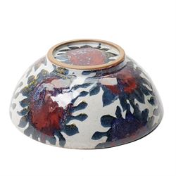 Sophie Hamilton (1963-): Sunflower bowl, decorated with blue and red sunflowers on a pale ground, unmarked, D34cm