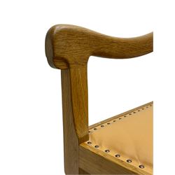 Mouseman - oak carver elbow chair, pierced and carved lattice back over leather upholstered seat with stud band, on octagonal supports united by plain stretchers, carved with mouse signature, by the workshop of Robert Thompson, Kilburn 