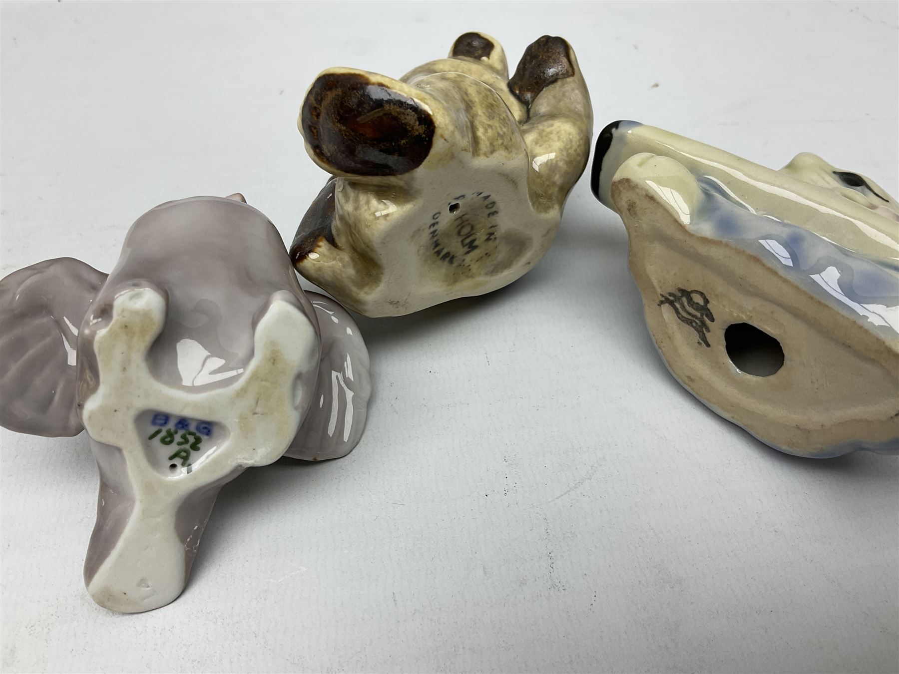 Three Beswick figures of horses, comprising Palomino foal 915, Dapple Grey foal and bay, together with Bing & Grondahl 1852 fledging sparrow modelled as a hungry baby bird and two other animal figures