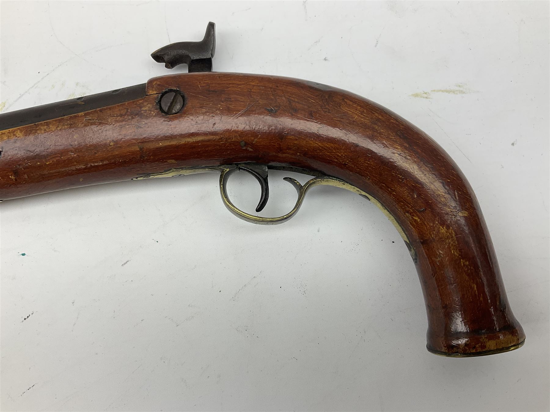 Re-manufactured percussion converted from flintlock single barrel pistol, the 20cm barrel with ramrod under, reused back action lock, brass furniture and hardwood stock L41cm overall