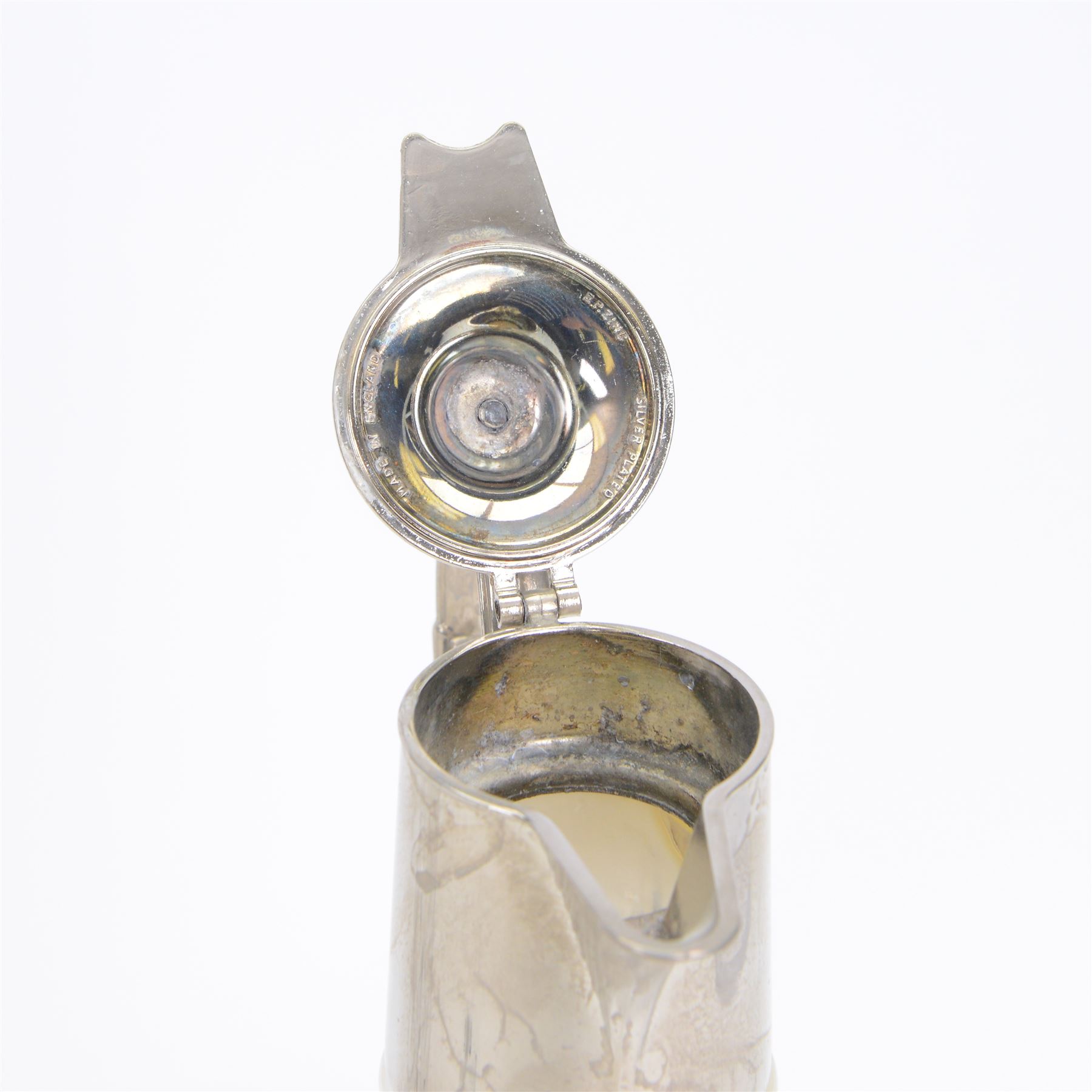 Silver plate mounted glass claret jug, the glass body of tapering form, the hinged lid a lion finial with shield shaped empty cartouche, the collar and spout cast with Bacchus face masks surrounded by grapes and vines, together with another silver plate mounted example, tallest H33cm