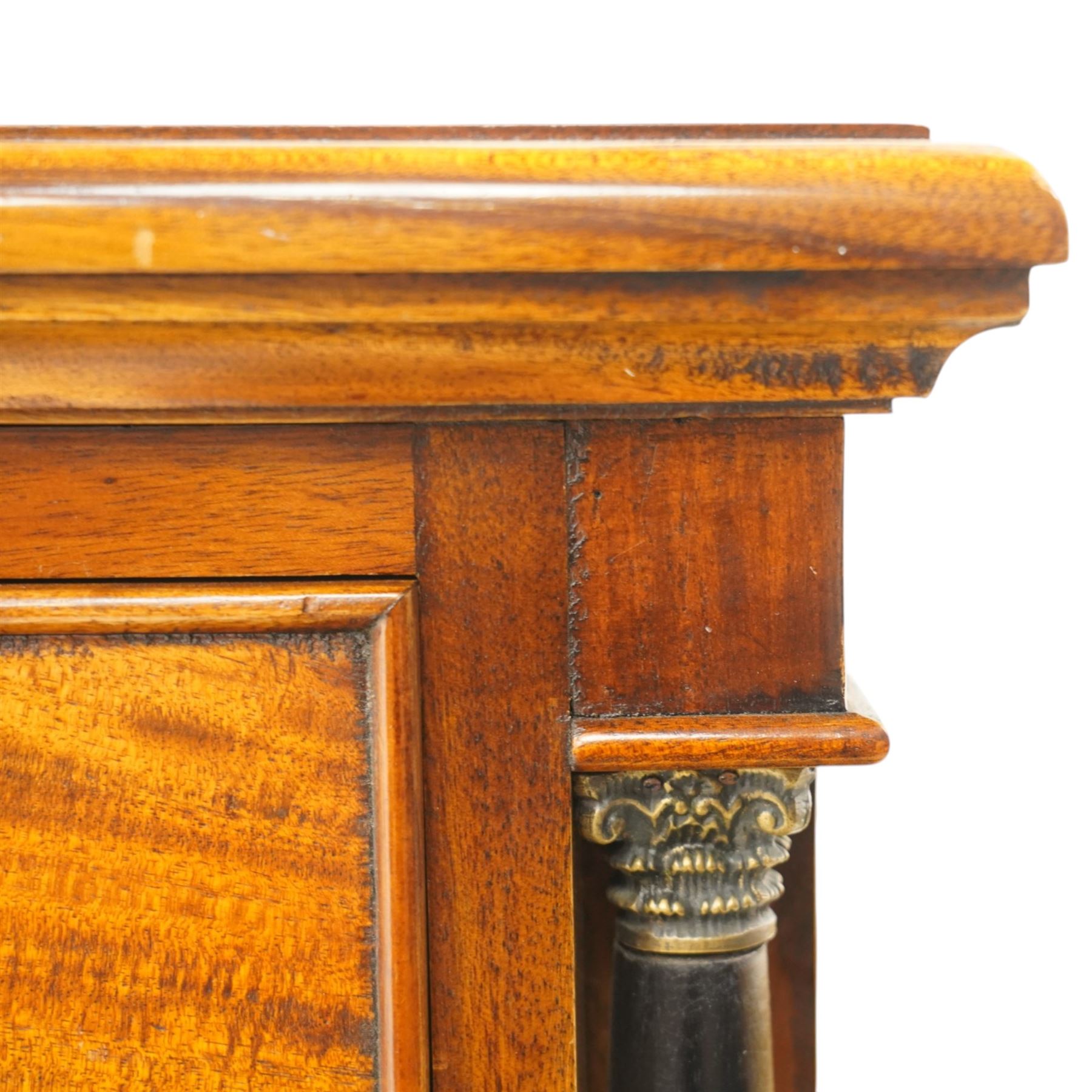 Neoclassical design cherry wood tall pedestal chest, fitted with seven drawers with swan neck handles, flanked by ebonised pilasters with composite capitals, fielded panelled sides on bracket feet