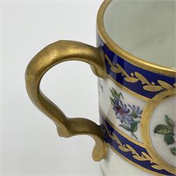 19th Sèvres style porcelain cup and saucer, the cup painted with a figural scene, against a scalloped border of scrolling floral swags on a blue ground, together with a Sèvres soft paste porcelain coffee can and saucer, painted with panels of exotic birds, roses and a border of cornflowers, LL monogram enclosing date letters H above painters mark, coffee can H6.5cm, saucer D13.5cm (2)