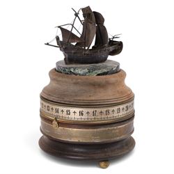 Limited edition Charles Frodsham of London for The St. James's House Company 'Mariners World Clock', the cylindrical brass and wooden body with two silvered annular chapter rings displaying the time and world location, surmounted by silver model of the Golden Hinde upon marble plinth, no. 240/500, H24cm 