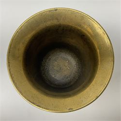 Victorian brass pestle and mortar, with twin handles, decorated in relief with lion rampant to either side, mortar H12cm