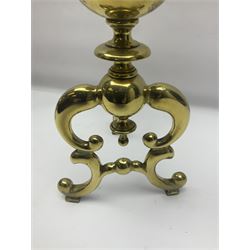 Pair of early 20th century brass fire dogs, each with sphere and urn finial, upon a scrolling base, H38cm