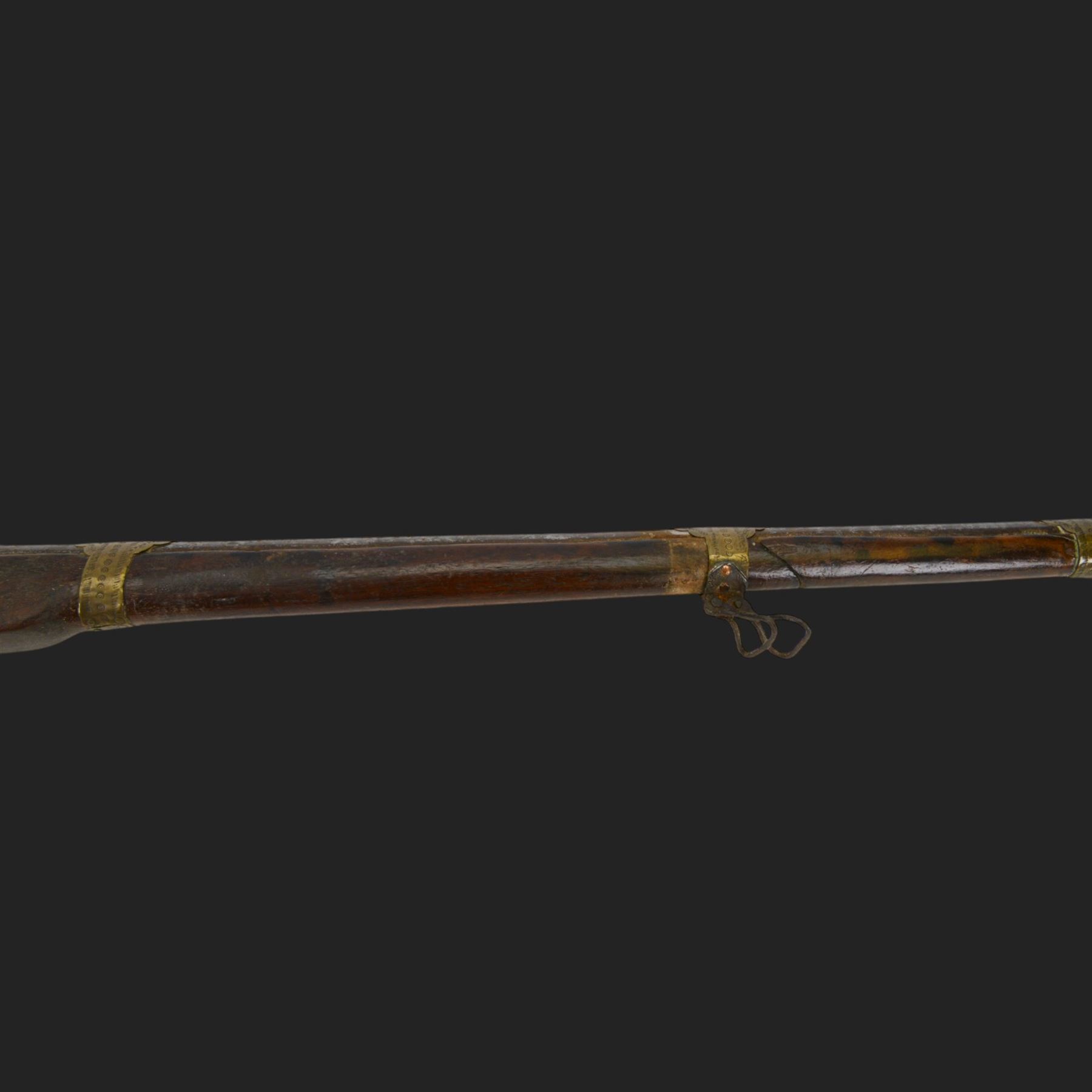 Middle Eastern percussion cap rifle, the 107cm  barrel with four brass bands and ramrod under, overall L143cm, together with another percussion rifle the 106cm barrel a copy of a 17th century Spanish barrel, complete with fake stamp, by vendors repute this rifle was confiscated from tribesmen in Kurdistan by police
Sold as an exempt item under Section 58 (2) of the 1968 Firearms Act, to be held as a curiosity or ornament