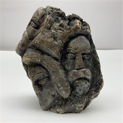 Double sided stone carving, depicting faces, signed Venezuelan to the base, H16cm