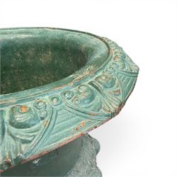 Pair of Victorian cast iron campana garden urns, the flared rim with repeating stylised anthemion motifs with scrollwork, over a deep gadrooned and Aesthetic moulded underbelly, fluted and foliate lower bowls on square pedestal bases, in antique green-painted finish
