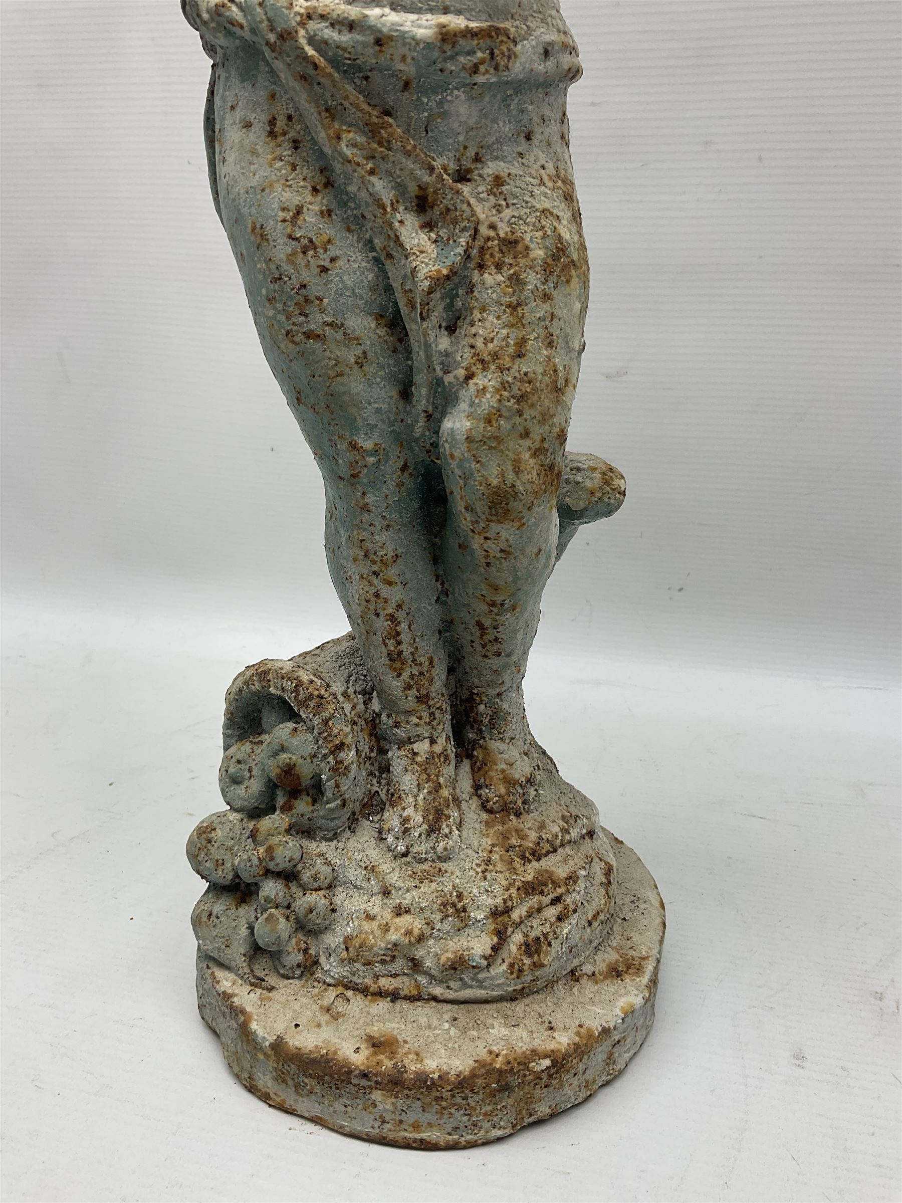 Garden ornament modeled as a putti with butterfly, H50cm