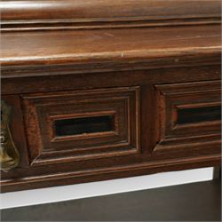 Late 19th to early 20th century Bonheur de Jour or writing bureau, the upper section enclosed by fall front decorated with geometric mouldings and oval inlaid panels depicting floral urns and swags, fitted with document divisions and two small drawers, the lower section fitted with two drawers with applied mouldings, on turned supports united by undertier, 'Hobbs & Co of London' locks
