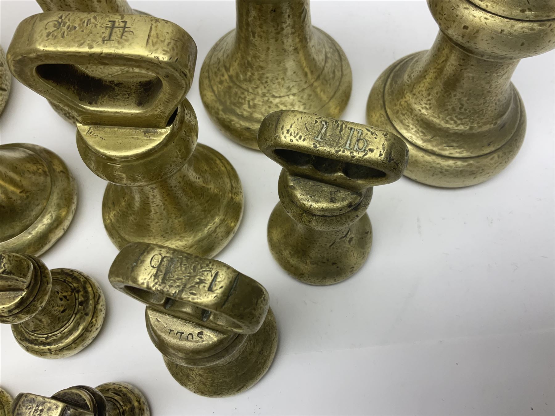 Set of seventeen Victorian brass bell weights