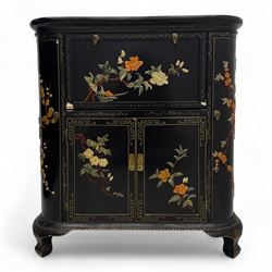 Early 20th century Chinoiserie lacquered cabinet, rounded rectangular top above a fall front enclosing fitted interior with lacquered decoration, over a pair of cupboard doors and flanked by side compartments with tiered bottle shelves, the black lacquer ground decorated throughout with raised and painted floral sprays, on shaped bracket feet