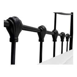 Contemporary Victorian revival black metal day bed, featuring arched back and sides with turned finials and spindle rails, complete with single 'OTTO' mattress