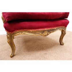  French upholstered wing back chair, the gilt frame with scroll carved cresting and acanthus arms, serpentine frieze on cabriole legs, loose seat cushion, W76cm, D68cm, H123cm   