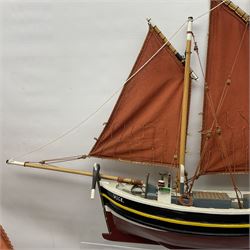 Wooden model of the Peterhead Herring Fishing Boat, Love Divine, PD404. on stand together with Wick Herring Fishing Boat, Galilee WK.1. on stand, L105cm, H64cm
