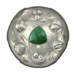 Liberty & Co Tudric pewter Bollelin tray, designed by Archibald Knox, of circular form with shaped edge, cast in relief with foliate tendrils surrounding a green enamel cartouche, impressed beneath Made by Library & Co English Pewter 044, D25.5cm
