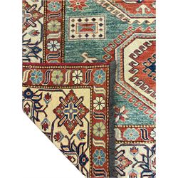 Kazakh rug, pale green ground field with three part medallion, three band border decorated with stylised plant motifs