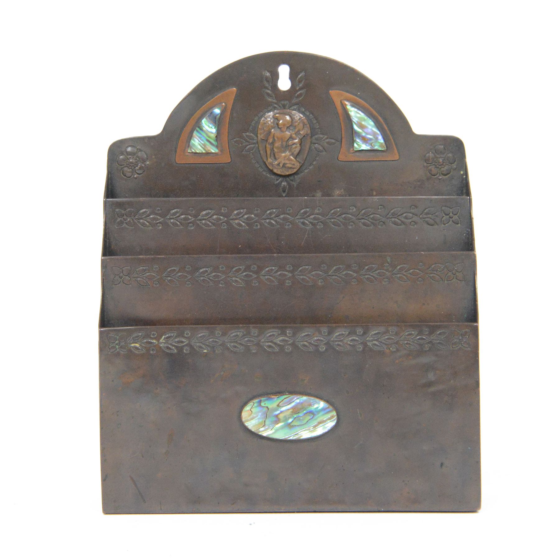 Arts and Crafts bronze letter rack, with three divisions, abalone cartouche to the front, the arch pediment with central figure flanked by abalone and impressed floral decoration, H19cm  