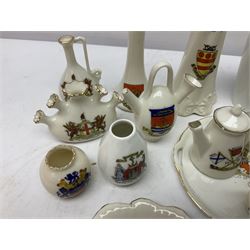 Collection of crested ware, including vases, hat pin stand, miniature teapot etc 