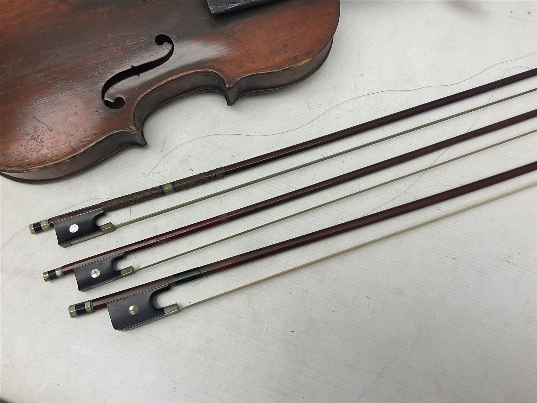 Incomplete amateur made violin c1880 for restoration and completion with 36.5cm one-piece maple back and ribs and spruce top L59.5cm; together with two brazilwood violin bows and pernambuco cello bow, all with nickel mounts (4)