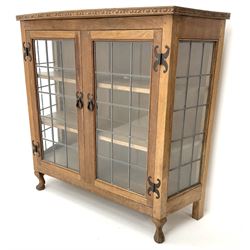 David 'Oakleaf man' Langstaff of Easingwold Yorkshire oak cabinet, egg and dart detailing, with two lead glazed doors enclosing two shelves, bearing oak leaf signature, cabriole claw feet