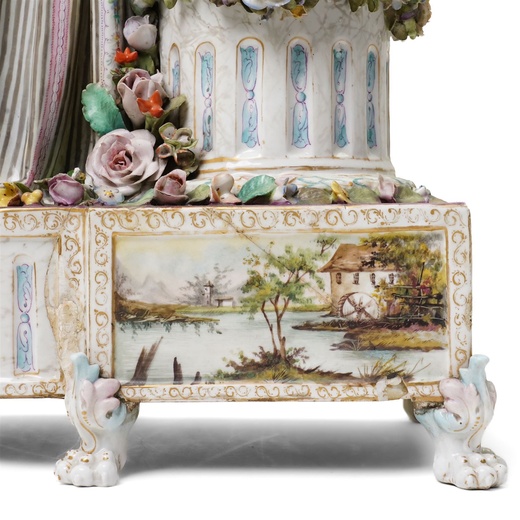 Large19th century  German porcelain mantel clock with white dial and striking movement, the case with a standing figure of Flora resting on a pillar with floral applied decoration, the base painted eith landscape and floral panels on paw feet H77cm W43cm