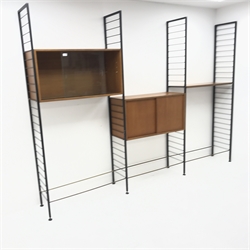 Staples Ladderax three bay sectional wall unit, two teak units comprising of solid and glazed sliding door cabinet, single shelf, W186cm, H201cm, D36cm