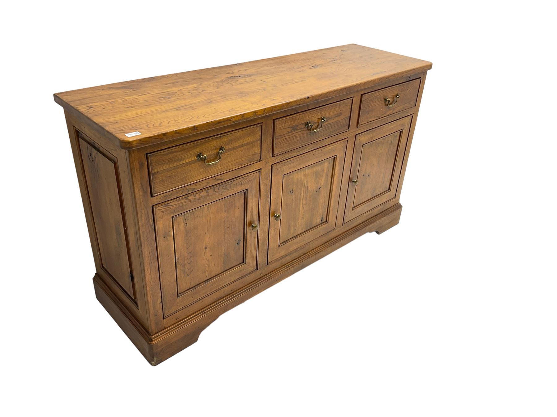 Willis & Gambier - oak sideboard, three drawers over three panelled cupboards, on bracket feet 