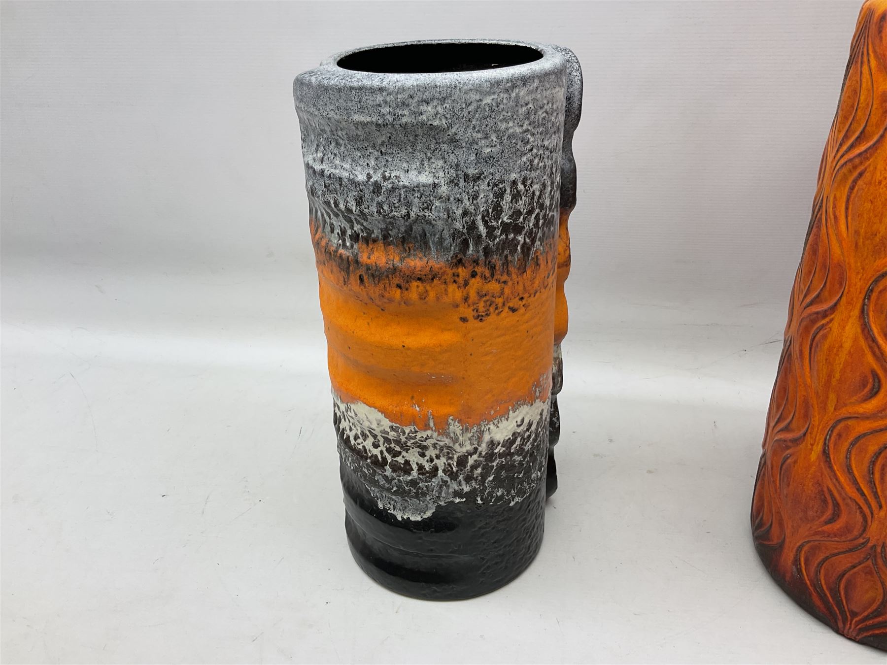 Two large West Germany pottery vases of cylindrical form with black and orange moulded decoration, with impressed marks beneath, largest H