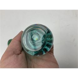 Three millefiori paperweights, together with a green glass dump paperweight with air bubble inclusions, Caithness Daisy and Cauldron paperweights and two small Caithness glass vases, tallest H9cm