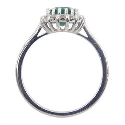 White gold oval emerald and round brilliant cut diamond ring, stamped 18K, emerald approx 1.30 carat
