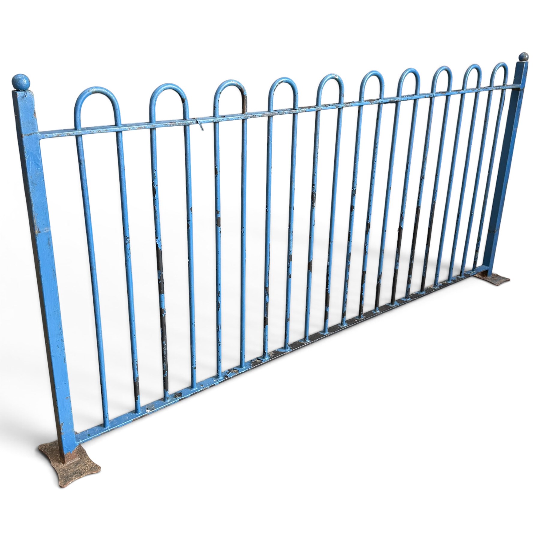 Two sections of painted iron garden or estate boundary railing, comprising a 19th century wrought iron section with graduated spearhead uprights, together with a later hoop-top section with ball-finial end posts, both in blue painted finish