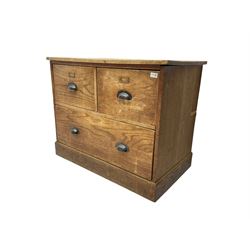 Early to mid-20th century oak chest, fitted with two short drawers over one long drawer, raised on plinth base