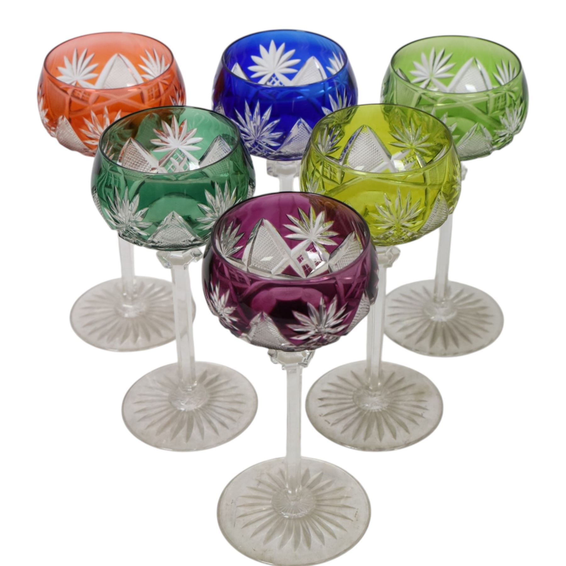 Set of six 20th Century Val St Lambert Berncastel style crystal glass wine glasses, in yellow, greens, red, purple and blue, flash cut with a repeat diamond and plume pattern above a knopped cut stem and circular spread foot, H18cm