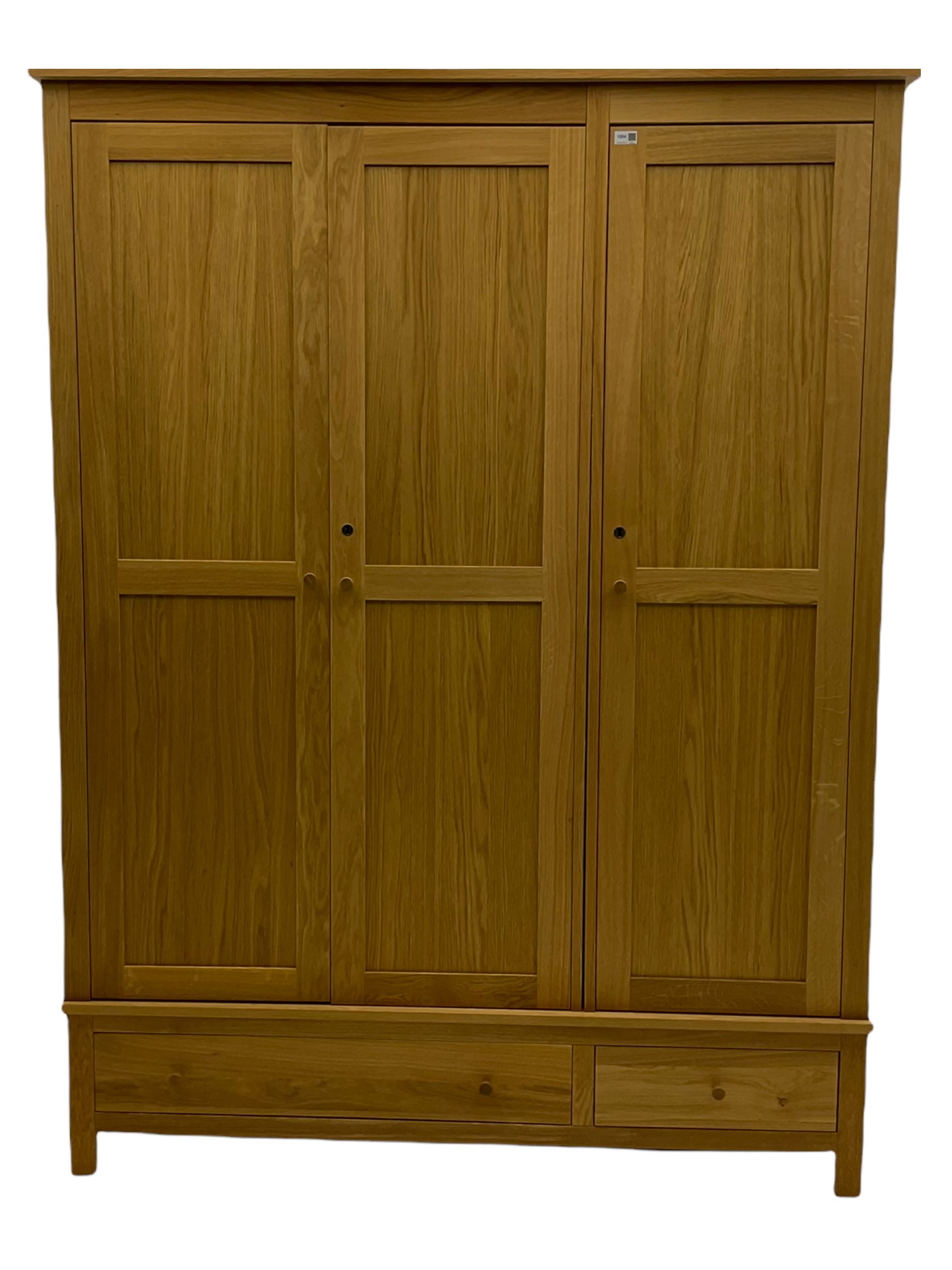 Corndell Furniture - light oak triple wardrobe, enclosed by three panelled doors, one long and one short drawer
