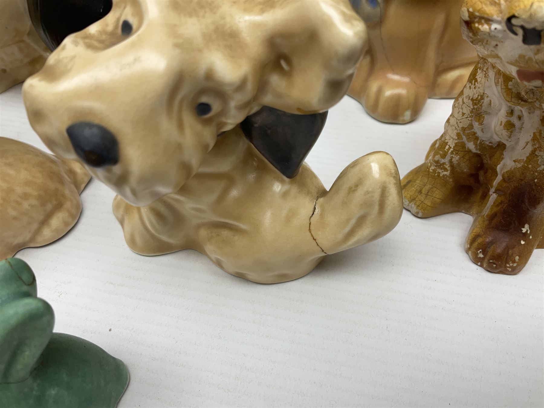 Collection of Sylvac and similar animal figures, including rabbits, hares and dogs, together with Falcon budgie vase, etc 