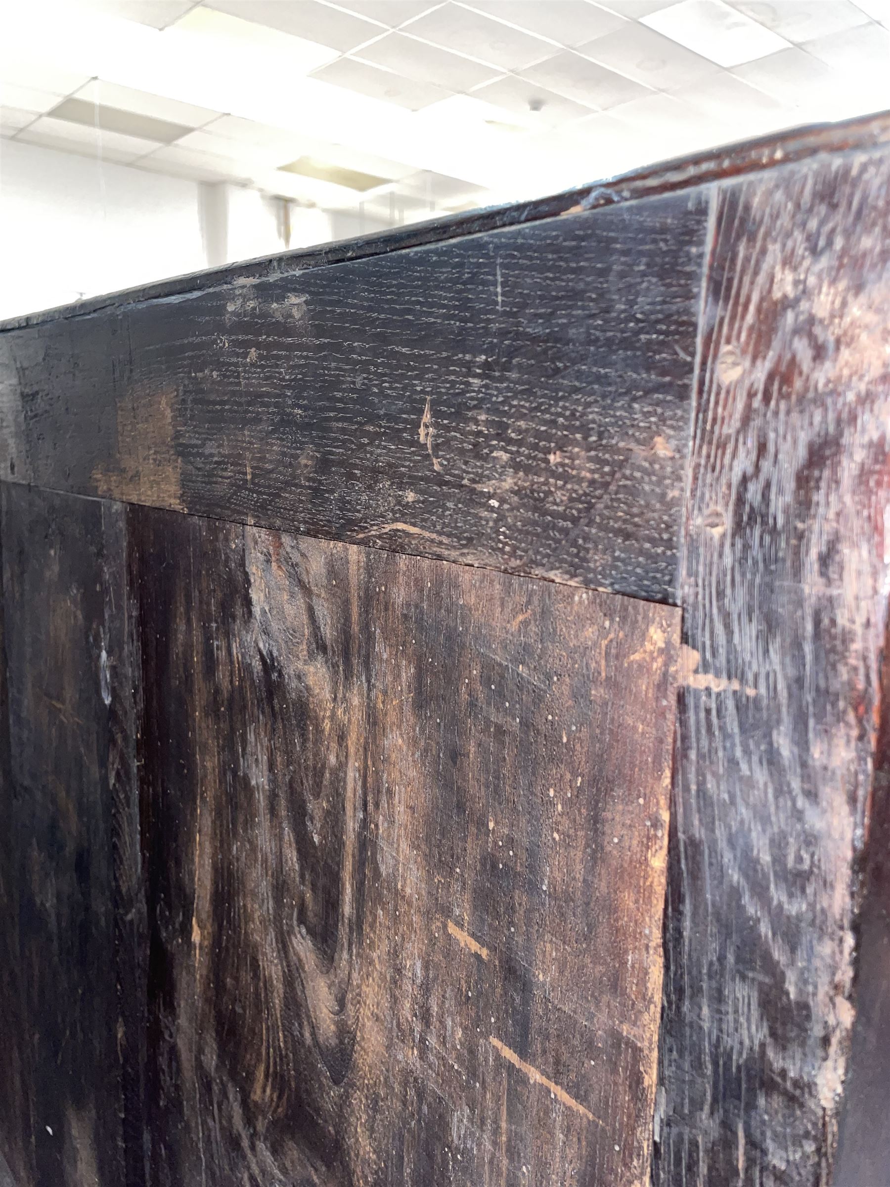 17th century oak chest on stand, moulded cornice over block work frieze, the upper section fitted with three long drawers each decorated with applied geometric mouldings and faceted panels, panelled sides with moulded frame, the stand fitted with two drawers, on five turned supports united by plan flat stretchers, terminating to turned feet