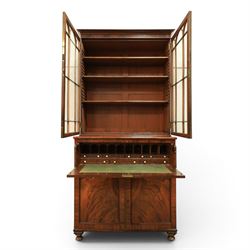 Early 19th century mahogany secretaire-bookcase, projecting cornice above astragal glazed cabinet with adjustable shelved interior, fall front secretaire drawer, fitted interior with pigeonholes and drawers, flame mahogany fronted cabinet with three drawers, on turned supports 