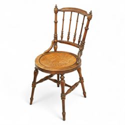 Early 18th century oak cradle dated AD 1710 and late 19th century kitchen chair, the cradle of pegged construction with shaped headboard and turned finials, raised on curved rockers (H 75cm, W 94cm, D 62cm), the chair with spindle back, turned supports and circular seat (H 89cm, W 42cm, D 47cm)