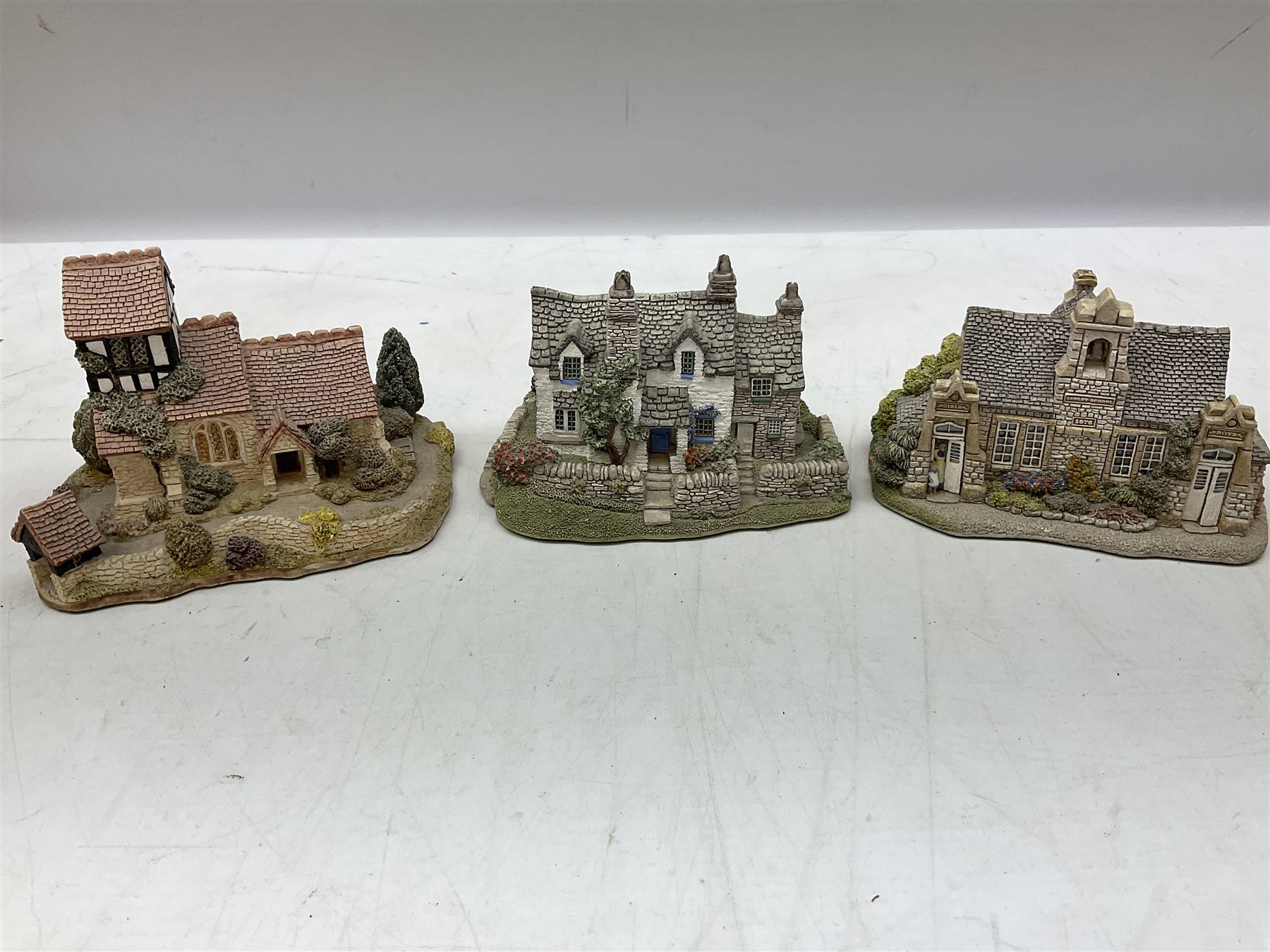 Eleven Lilliput Lane models, to include St Marks, Rose Cottage, Puffin Row, Village School, Swan Inn etc, all boxed