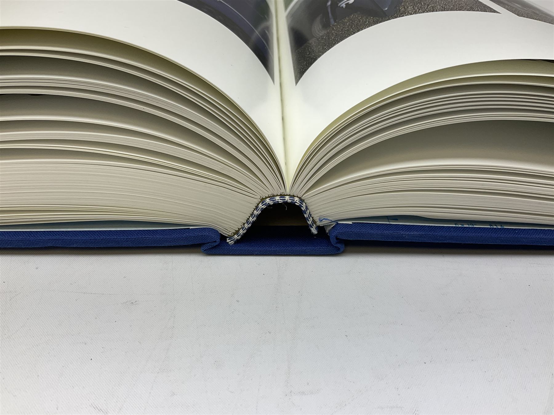 Bugatti Magnum by Hugh Conway and Maurice Sauzay, pub. Foulis Haynes 1989, with original engine turned slipcase with gilt metal label bearing 'Ettore Bugatti Molsheim Alsace', chassis no. 1636, the blue cloth bound book with monochrome and colour plates, limited edition of 2,000