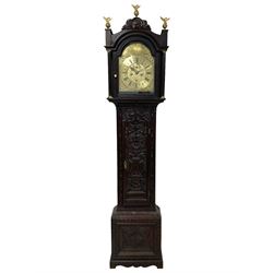 18th-century profusely carved oak longcase clock - with a pagoda pediment, upstands and carving, 
 break arch hood door flanked by reeded pilasters with brass capitals, trunk with canted corners and a spire topped door, square plinth with applied skirting, break arch brass dial with wheatsheaf engraving and cast cherub and crown spandrels, engraved break arch with the London clockmakers name John Gordin, silvered chapter ring with Roman numerals, five minute Arabic's, minute and quarter hour tracks, matted dial centre with ringed winding holes, square date aperture and seconds ring, dial pinned to a five pillar movement with inside countwheel striking, striking the hours on a cast bell. With weights and pendulum. John Gordin, is possibly a mis-spelling or phonetic spelling of John Gordon, of London, who worked from Ludgate Street in the parish of St. Gregory by St. Pauls. Apprenticed in 1689 and died in 1732 when his will was proven.
