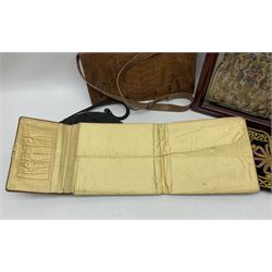 Continental petit point evening bag, with enamel and pearl details, in wooden display frame, together with a snake skin handbag and three other vintage bags